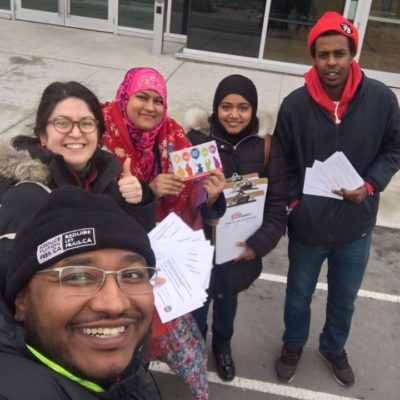 Muslim Workers Network handing out flyers and postcards